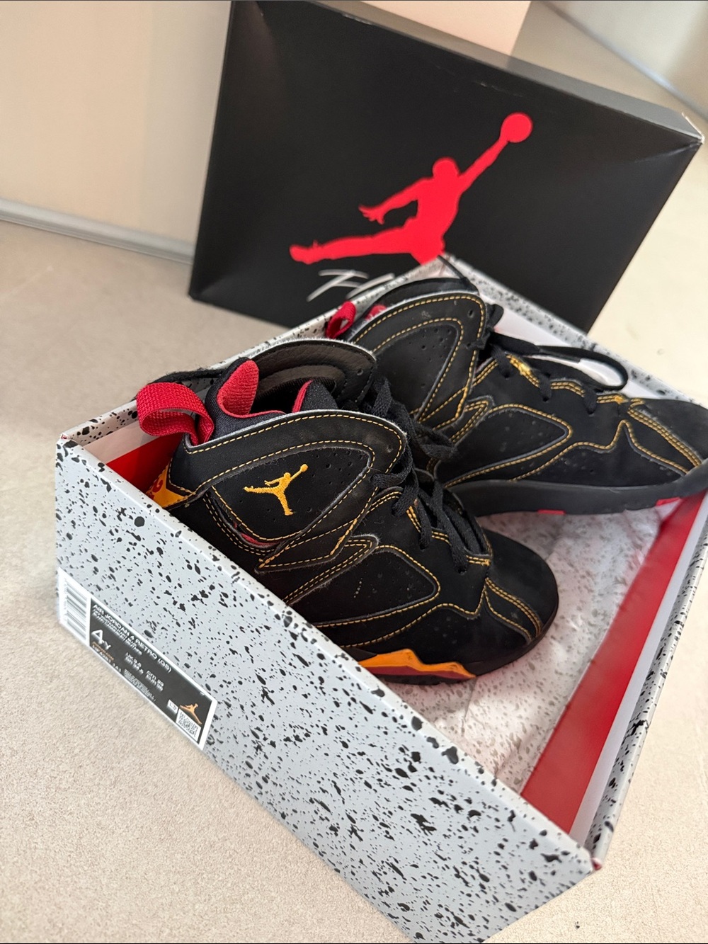 Jordan Kids Black Sneakers with Red and Gold Details